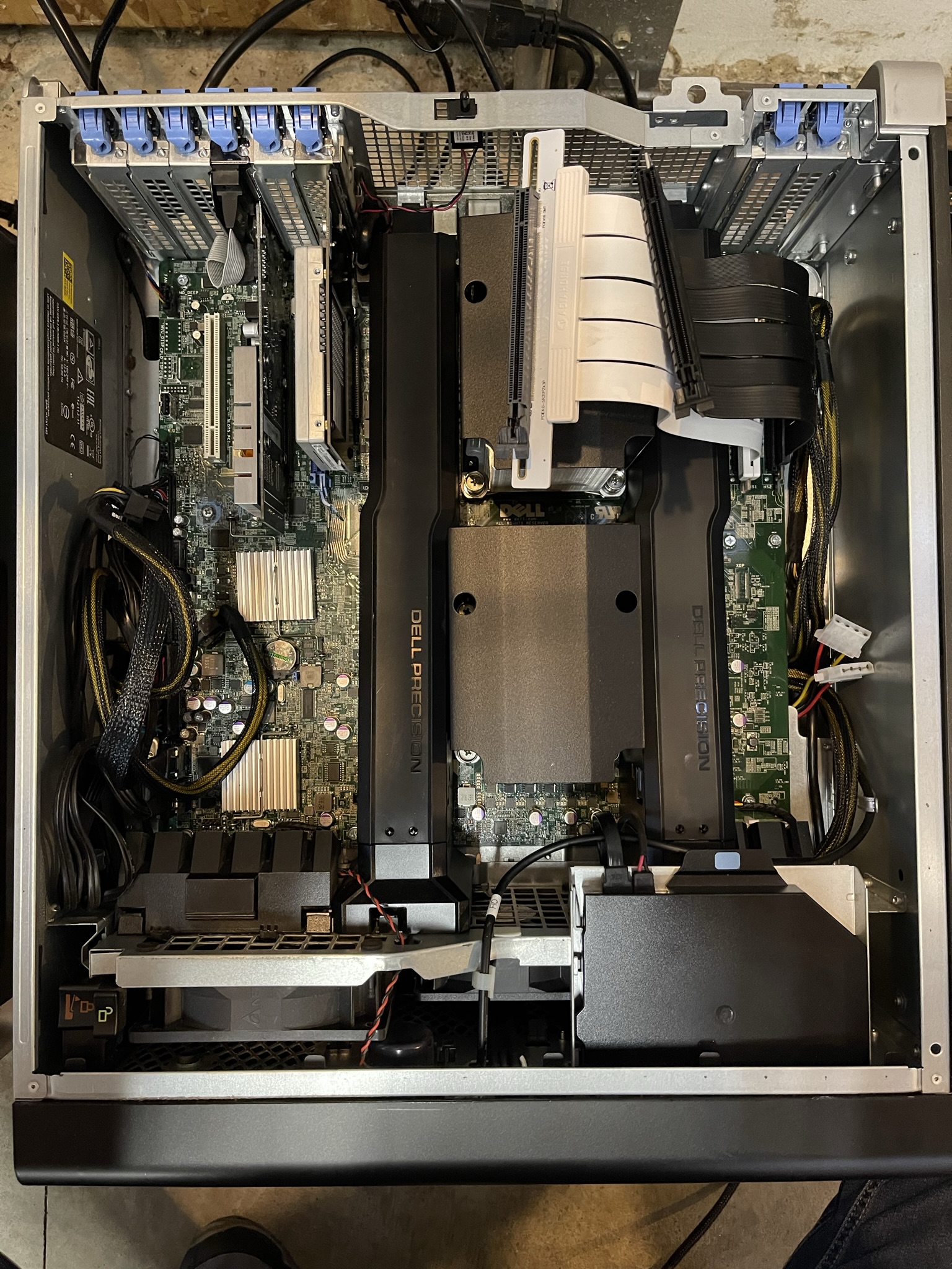 Dell Precision 7600 Workstation has four full PCIe 3.0 x16 slots. I've used PCIe ribbon extender cables to connect GPUs.